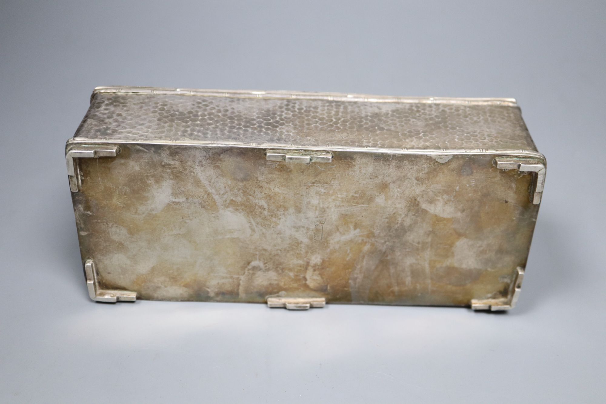 A Chinese planished silver casket, c.1900, with twin dragon decoration and divided interior, marks worn, 19cm